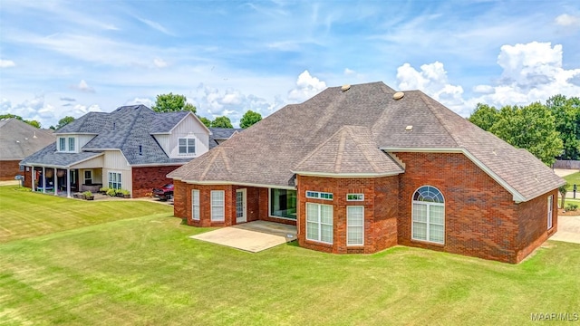 8330 Chadburn Way, Montgomery, AL 36116 - rear view of house featuring brick siding, a lawn, a patio, and a shingled roof