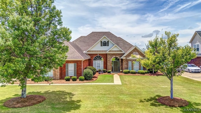 8330 Chadburn Way, Montgomery, AL 36116 - traditional-style home with brick siding, a front lawn, and a shingled roof