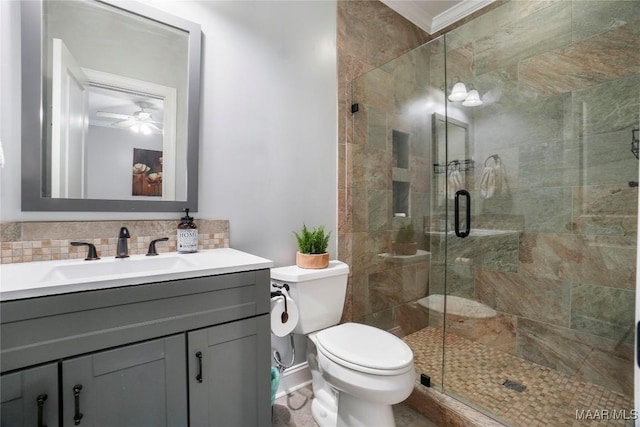 145 Mountain Meadows Ln, Wetumpka, AL 36093 - bathroom with vanity, a stall shower, a ceiling fan, tasteful backsplash, and crown molding