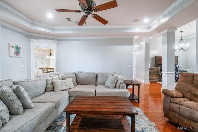 145 Mountain Meadows Ln, Wetumpka, AL 36093 - living area featuring wood finished floors, a ceiling fan, a raised ceiling, ornate columns, and crown molding