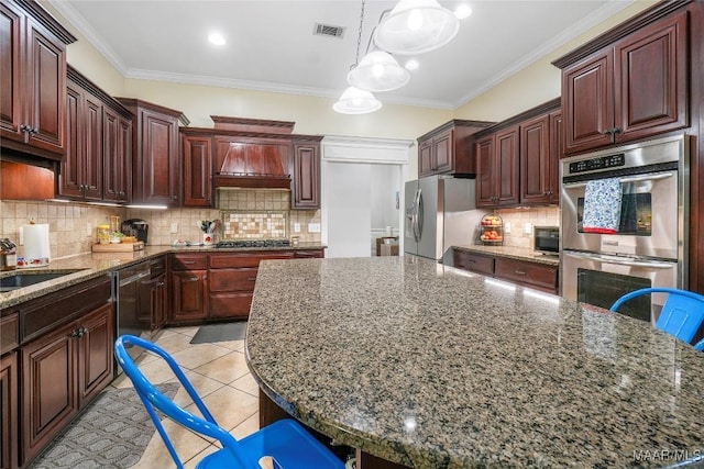 145 Mountain Meadows Ln, Wetumpka, AL 36093 - kitchen with stainless steel appliances, custom exhaust hood, light tile patterned floors, crown molding, and backsplash
