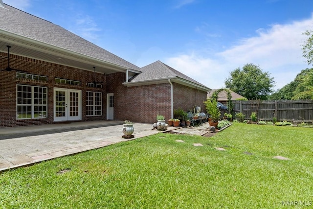 204 St Thomas Ave, Wetumpka, AL 36092 - back of house featuring french doors, brick siding, a patio, and a shingled roof