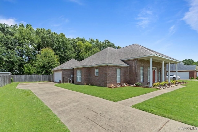 204 St Thomas Ave, Wetumpka, AL 36092 - view of front facade featuring driveway, a garage, brick siding, and a shingled roof