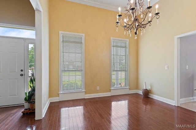 204 St Thomas Ave, Wetumpka, AL 36092 - entrance foyer featuring plenty of natural light, wood-type flooring, a chandelier, a high ceiling, and crown molding