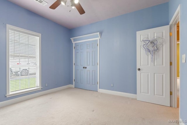 204 St Thomas Ave, Wetumpka, AL 36092 - unfurnished bedroom with carpet floors, a closet, and a ceiling fan