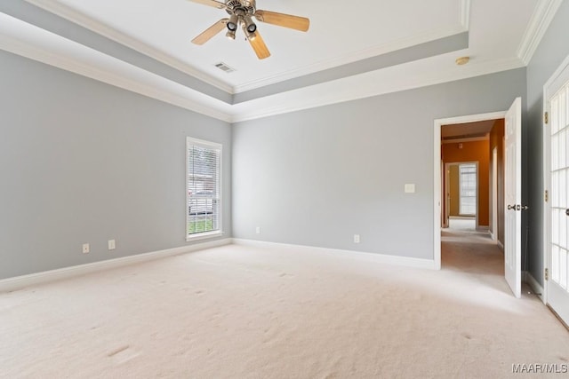 204 St Thomas Ave, Wetumpka, AL 36092 - empty room with crown molding, a raised ceiling, light carpet, plenty of natural light, and ceiling fan