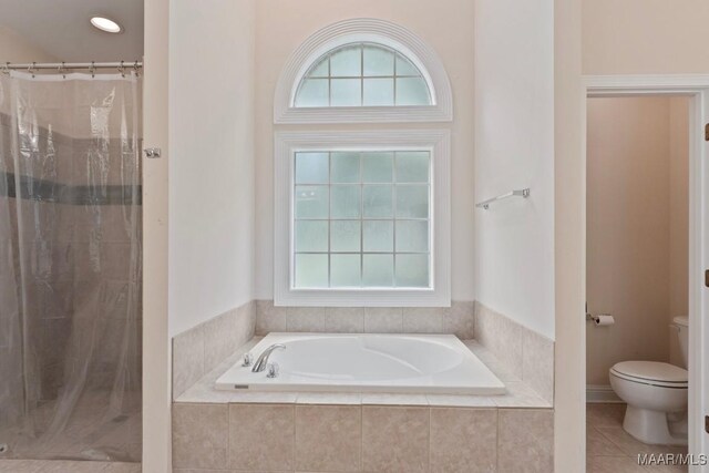 204 St Thomas Ave, Wetumpka, AL 36092 - bathroom with a garden tub, a tile shower, healthy amount of natural light, and tile patterned floors