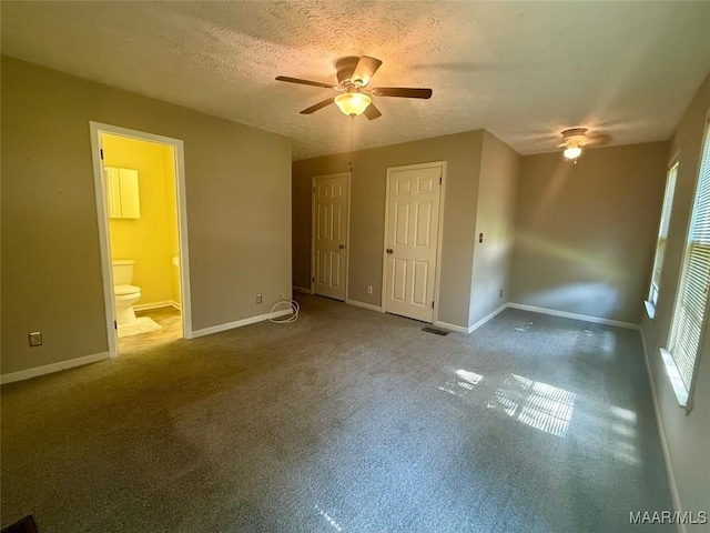 1604 Cobblestone Ct, Montgomery, AL 36117 - unfurnished bedroom with connected bathroom, a textured ceiling, carpet floors, and ceiling fan