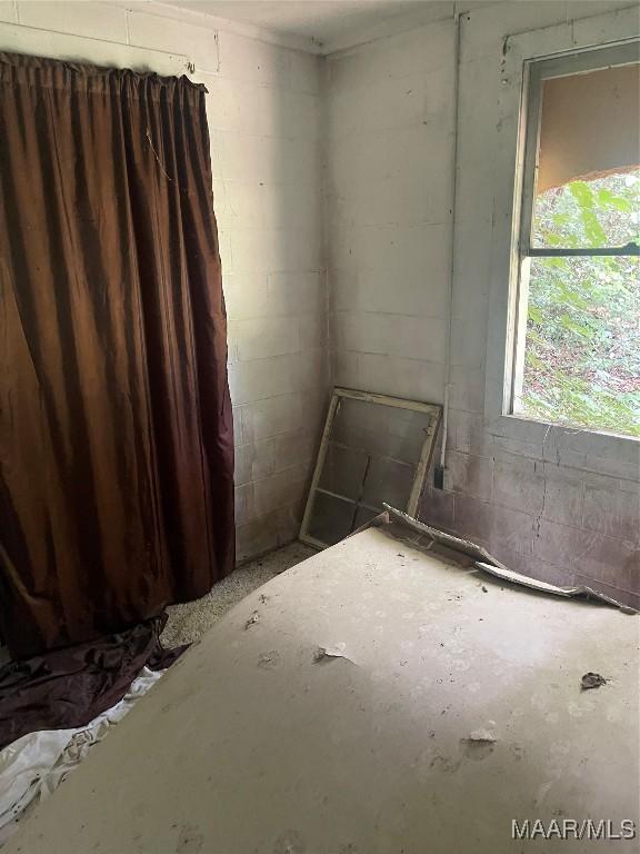 1987 Upper Wetumpka Rd, Montgomery, AL 36107 - empty room featuring concrete block wall