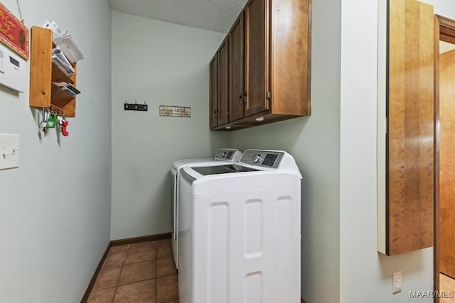 4015 Snowdoun Chambers Rd, Montgomery, AL 36116 - washroom featuring cabinet space, washing machine and clothes dryer, and tile patterned flooring