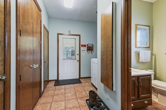 4015 Snowdoun Chambers Rd, Montgomery, AL 36116 - doorway to outside featuring a textured ceiling and light tile patterned flooring