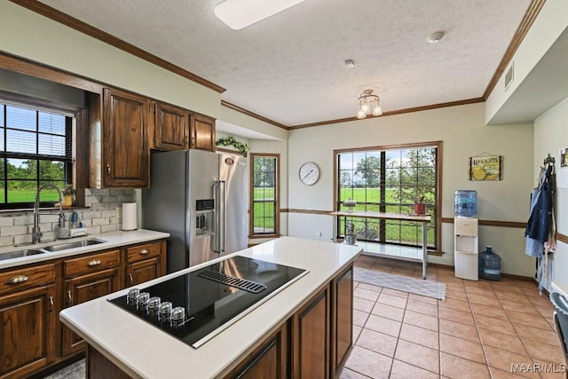4015 Snowdoun Chambers Rd, Montgomery, AL 36116 - kitchen featuring high end fridge, black electric stovetop, a textured ceiling, light countertops, and tasteful backsplash