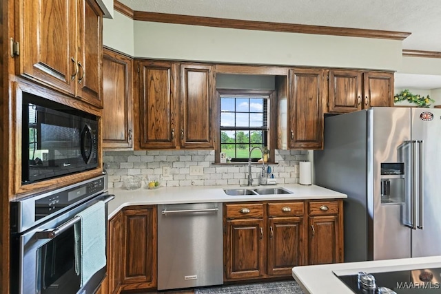 4015 Snowdoun Chambers Rd, Montgomery, AL 36116 - kitchen featuring appliances with stainless steel finishes, crown molding, light countertops, and backsplash