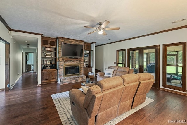 4015 Snowdoun Chambers Rd, Montgomery, AL 36116 - living area featuring ornamental molding, dark wood-style flooring, french doors, a ceiling fan, and a brick fireplace