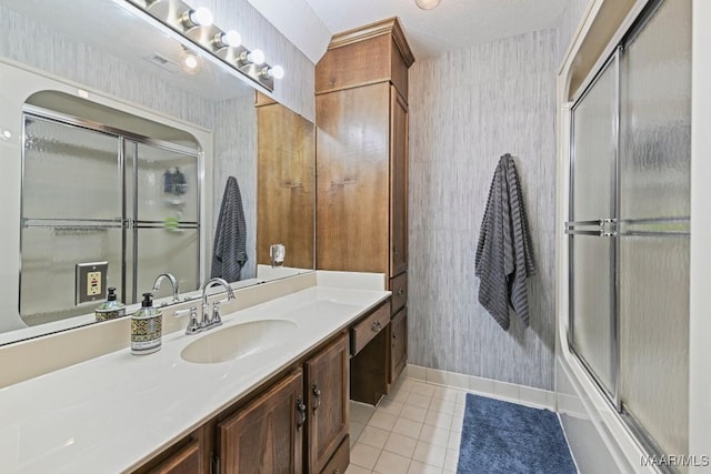 4015 Snowdoun Chambers Rd, Montgomery, AL 36116 - full bath with tile patterned flooring, wallpapered walls, vanity, and shower / bath combination with glass door