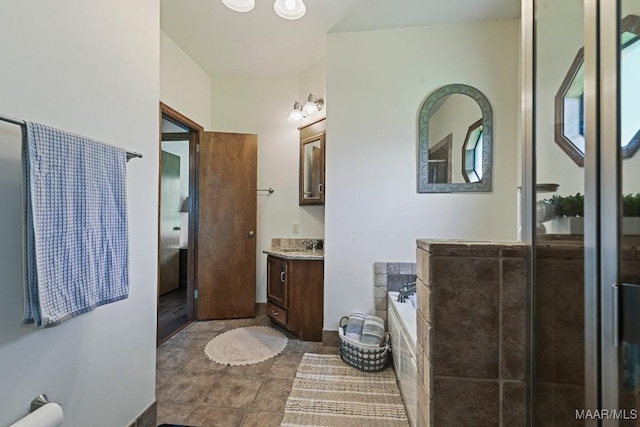 4015 Snowdoun Chambers Rd, Montgomery, AL 36116 - full bath with vanity, a garden tub, and tile patterned floors