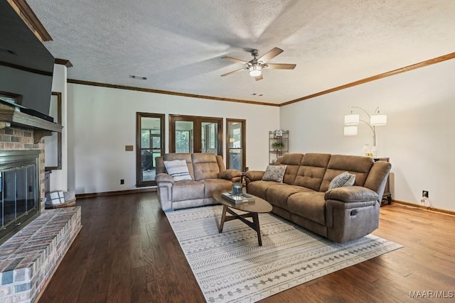 4015 Snowdoun Chambers Rd, Montgomery, AL 36116 - living area with a ceiling fan, a textured ceiling, a brick fireplace, wood-type flooring, and crown molding