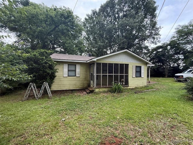 235 Wild Plum Trl, Wetumpka, AL 36093 - back of property with a lawn and a sunroom