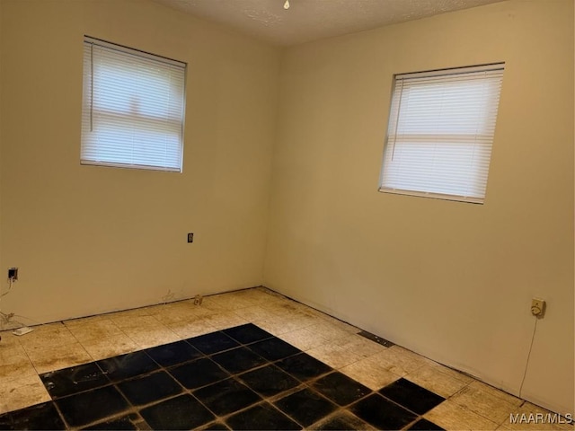 235 Wild Plum Trl, Wetumpka, AL 36093 - spare room with healthy amount of natural light and light tile patterned floors