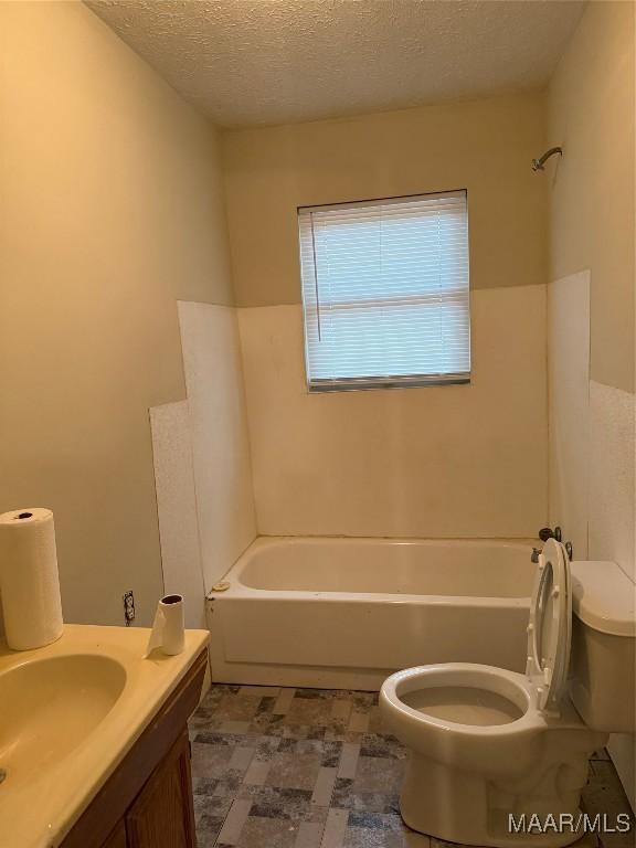 235 Wild Plum Trl, Wetumpka, AL 36093 - full bathroom featuring a textured ceiling and vanity