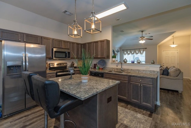 6642 Triston Way, Montgomery, AL 36117 - kitchen with appliances with stainless steel finishes, a peninsula, dark wood-style floors, and open floor plan