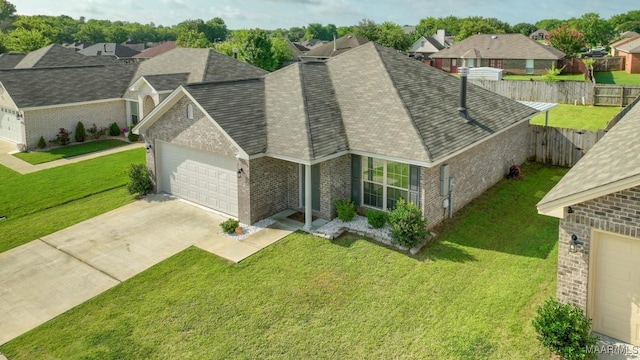 6642 Triston Way, Montgomery, AL 36117 - view of front facade with brick siding, an attached garage, concrete driveway, roof with shingles, and a residential view