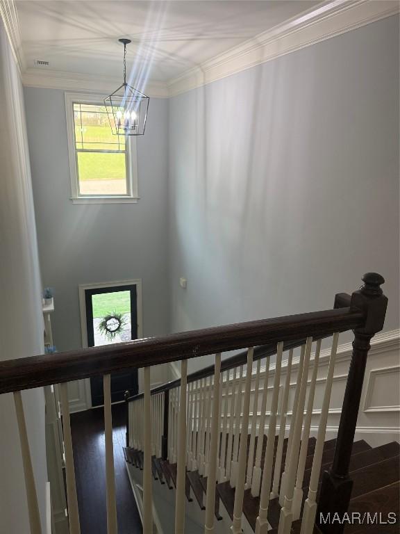 312 Sherwood Trl, Wetumpka, AL 36093 - stairs featuring ornamental molding and a chandelier