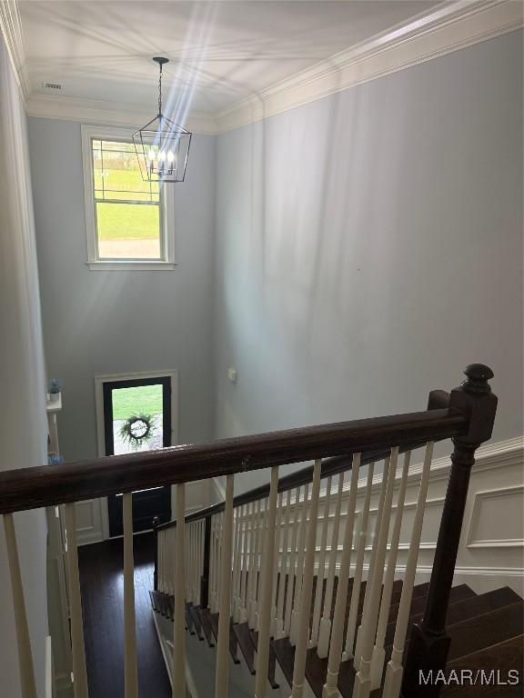312 Sherwood Trl, Wetumpka, AL 36093 - staircase featuring ornamental molding, a chandelier, and wood finished floors