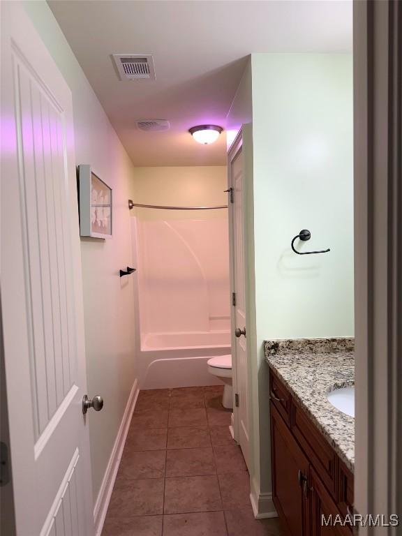 312 Sherwood Trl, Wetumpka, AL 36093 - bathroom featuring vanity,  shower combination, and tile patterned flooring
