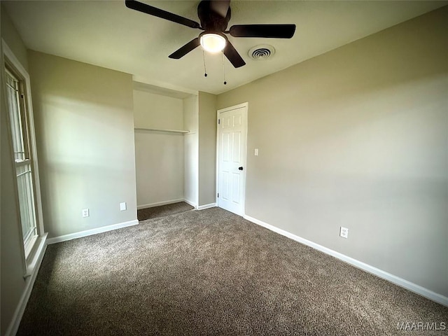 5204 Patricia Ln, Montgomery, AL 36108 - unfurnished bedroom featuring dark colored carpet, a ceiling fan, and a closet