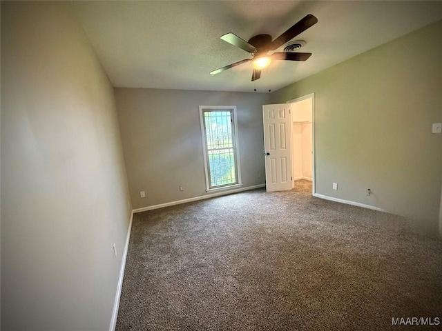 5204 Patricia Ln, Montgomery, AL 36108 - unfurnished bedroom with carpet flooring, a walk in closet, and ceiling fan