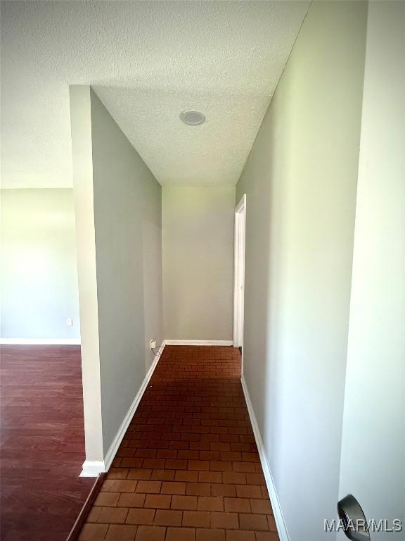 5204 Patricia Ln, Montgomery, AL 36108 - hallway with a textured ceiling and baseboards