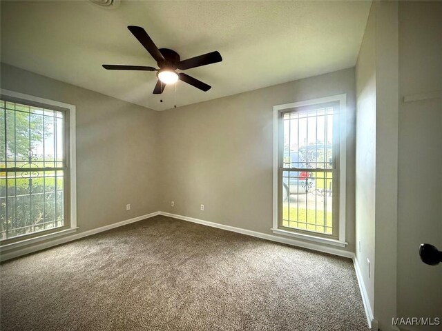 5204 Patricia Ln, Montgomery, AL 36108 - unfurnished room with dark colored carpet and ceiling fan
