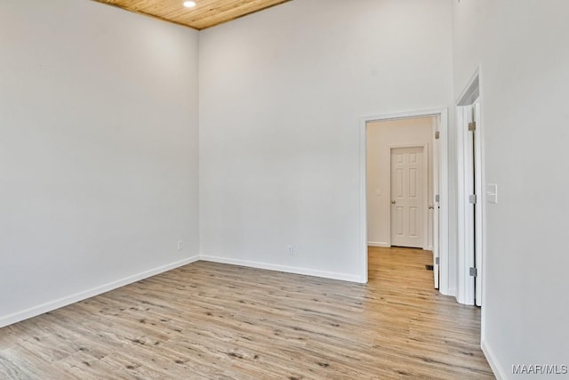 1415 Gold Mine Branch Rd, Marbury, AL 36051 - empty room featuring light wood-style flooring, a high ceiling, recessed lighting, and wood ceiling