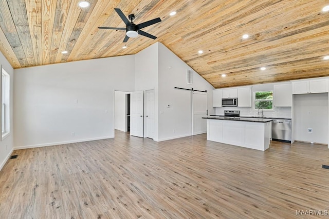 1415 Gold Mine Branch Rd, Marbury, AL 36051 - unfurnished living room with a barn door, wood ceiling, light wood-style floors, recessed lighting, and a ceiling fan