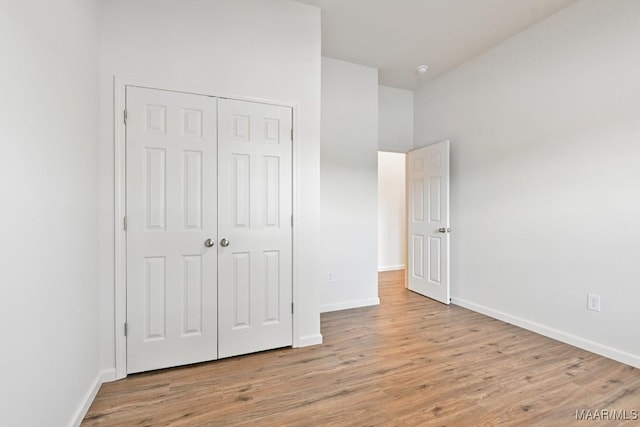 1415 Gold Mine Branch Rd, Marbury, AL 36051 - unfurnished bedroom with wood finished floors and a closet