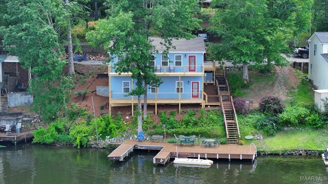 1415 Gold Mine Branch Rd, Marbury, AL 36051 - rear view of house featuring stairs, a balcony, and a deck with water view