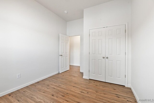 1415 Gold Mine Branch Rd, Marbury, AL 36051 - unfurnished bedroom with light wood finished floors and a closet