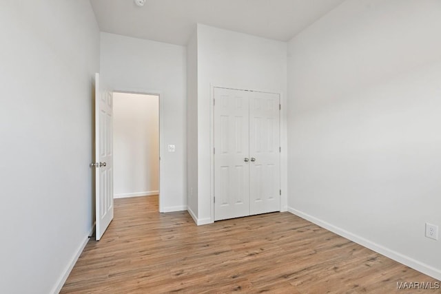 1415 Gold Mine Branch Rd, Marbury, AL 36051 - unfurnished bedroom with light wood-style floors and a closet