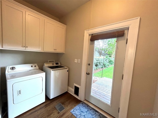 2412 College St, Montgomery, AL 36106 - washroom featuring washing machine and dryer, cabinet space, and dark wood-style flooring