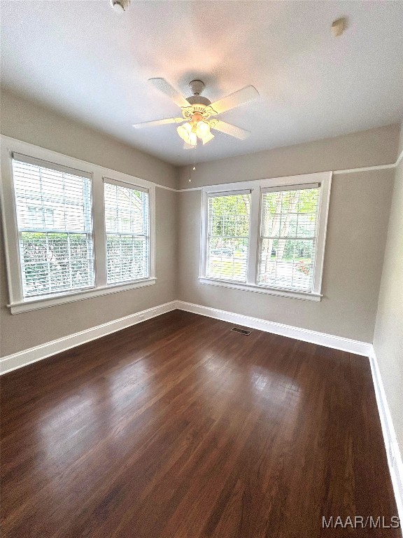2412 College St, Montgomery, AL 36106 - empty room with healthy amount of natural light, ceiling fan, dark wood finished floors, and a textured ceiling