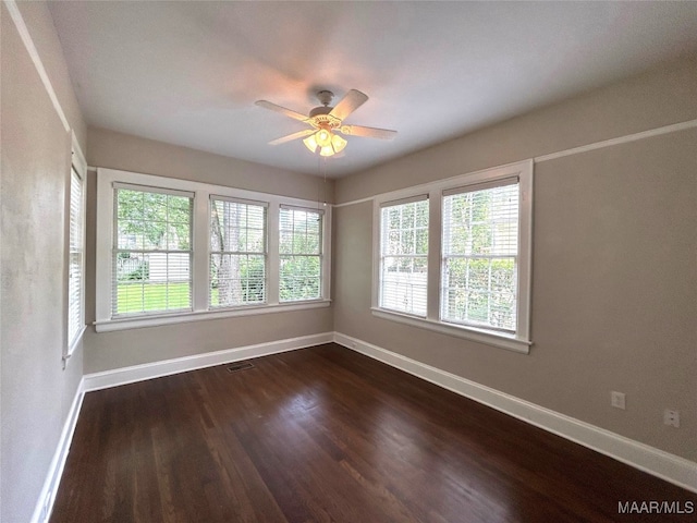 2412 College St, Montgomery, AL 36106 - unfurnished room featuring ceiling fan and dark wood-style flooring
