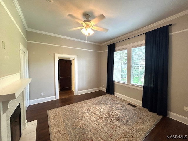 2412 College St, Montgomery, AL 36106 - unfurnished living room with wood finished floors, crown molding, ceiling fan, and a fireplace with raised hearth