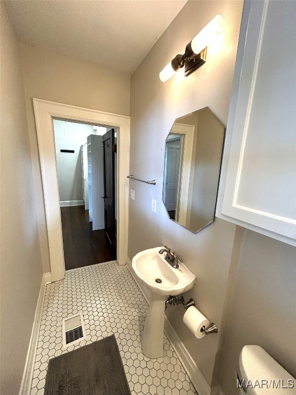 2412 College St, Montgomery, AL 36106 - bathroom featuring toilet and tile patterned floors