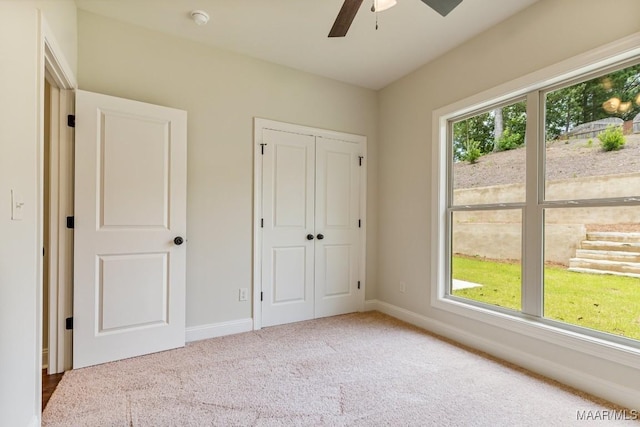 79 Birchwood Ln, Wetumpka, AL 36093 - unfurnished bedroom with carpet flooring, a closet, and a ceiling fan