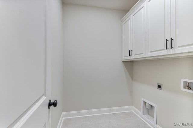 79 Birchwood Ln, Wetumpka, AL 36093 - laundry area featuring electric dryer hookup, cabinet space, washer hookup, and light tile patterned floors