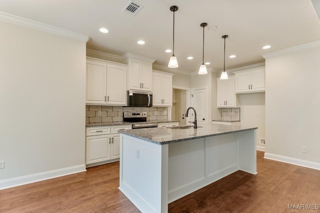 79 Birchwood Ln, Wetumpka, AL 36093 - kitchen featuring stainless steel appliances, ornamental molding, white cabinets, backsplash, and recessed lighting