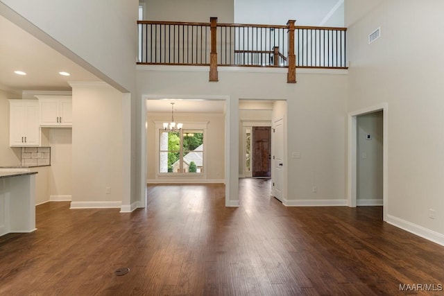 79 Birchwood Ln, Wetumpka, AL 36093 - unfurnished living room featuring a high ceiling, a chandelier, dark wood-style flooring, and recessed lighting