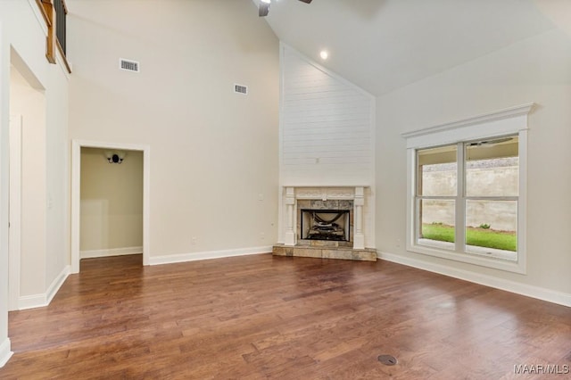 79 Birchwood Ln, Wetumpka, AL 36093 - unfurnished living room with high vaulted ceiling, a ceiling fan, a fireplace, and wood finished floors