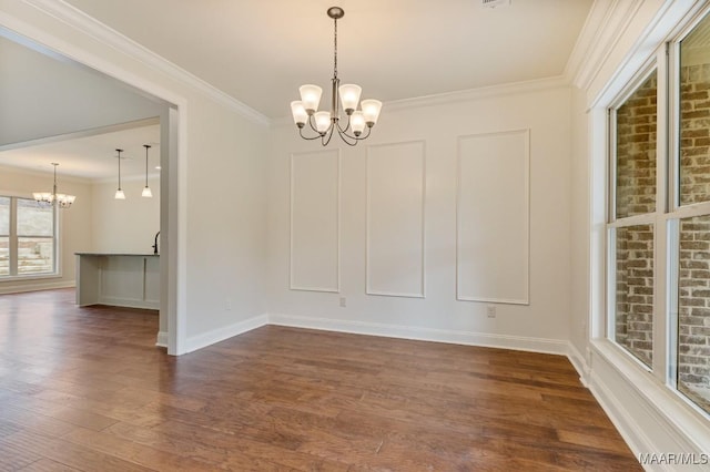 79 Birchwood Ln, Wetumpka, AL 36093 - empty room featuring a chandelier, dark wood finished floors, and ornamental molding